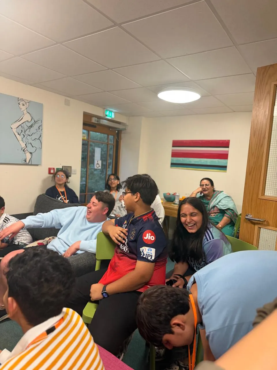 Students relaxing together during residential life on the UK immersion programme